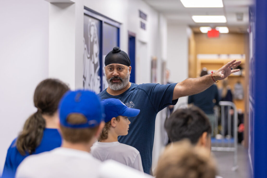 Coach giving facility tour